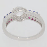 Back view of a Round White Moissanite Sterling Silver Ring showcasing accent gemstones in blue and pink.